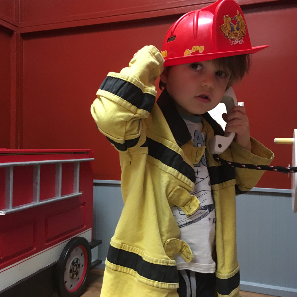 Children's fireman making a phone call